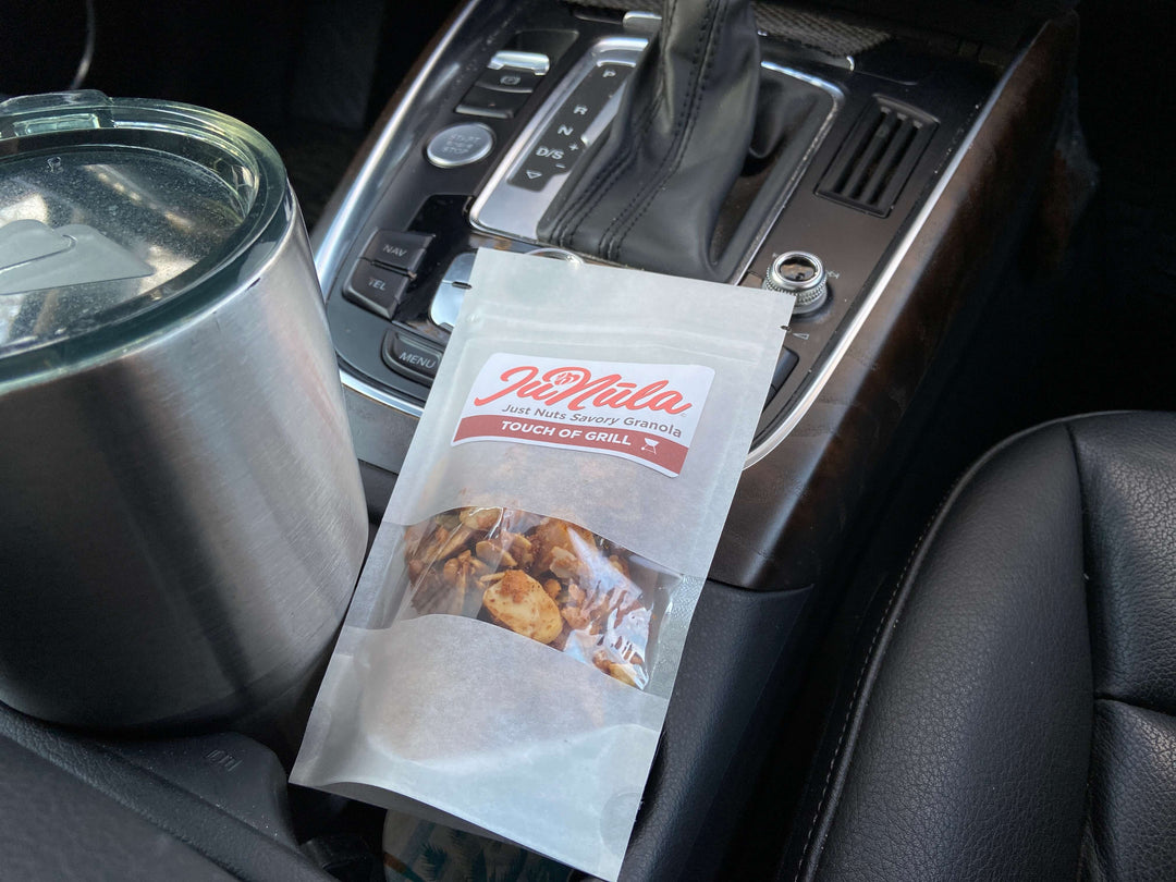Picture of Touch of Grill JuNula just nuts granola, low carb, grain free, gluten free savory salty granola snack in a two ounce to go pack ready to go on a roadtrip