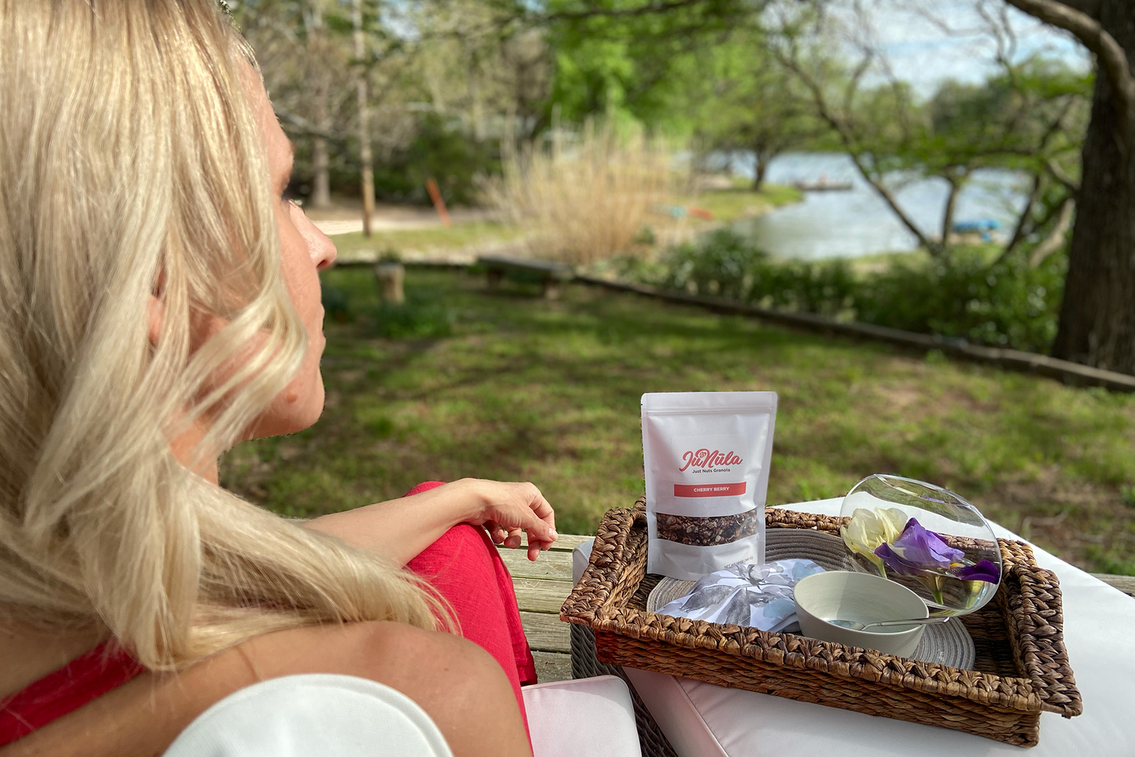Judit Hodges of JuNula Just Nuts Granola sitting on the deck enjoying a lovely day