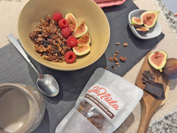 Bowl of Just Enough Chocolate granola with raspberries and figs